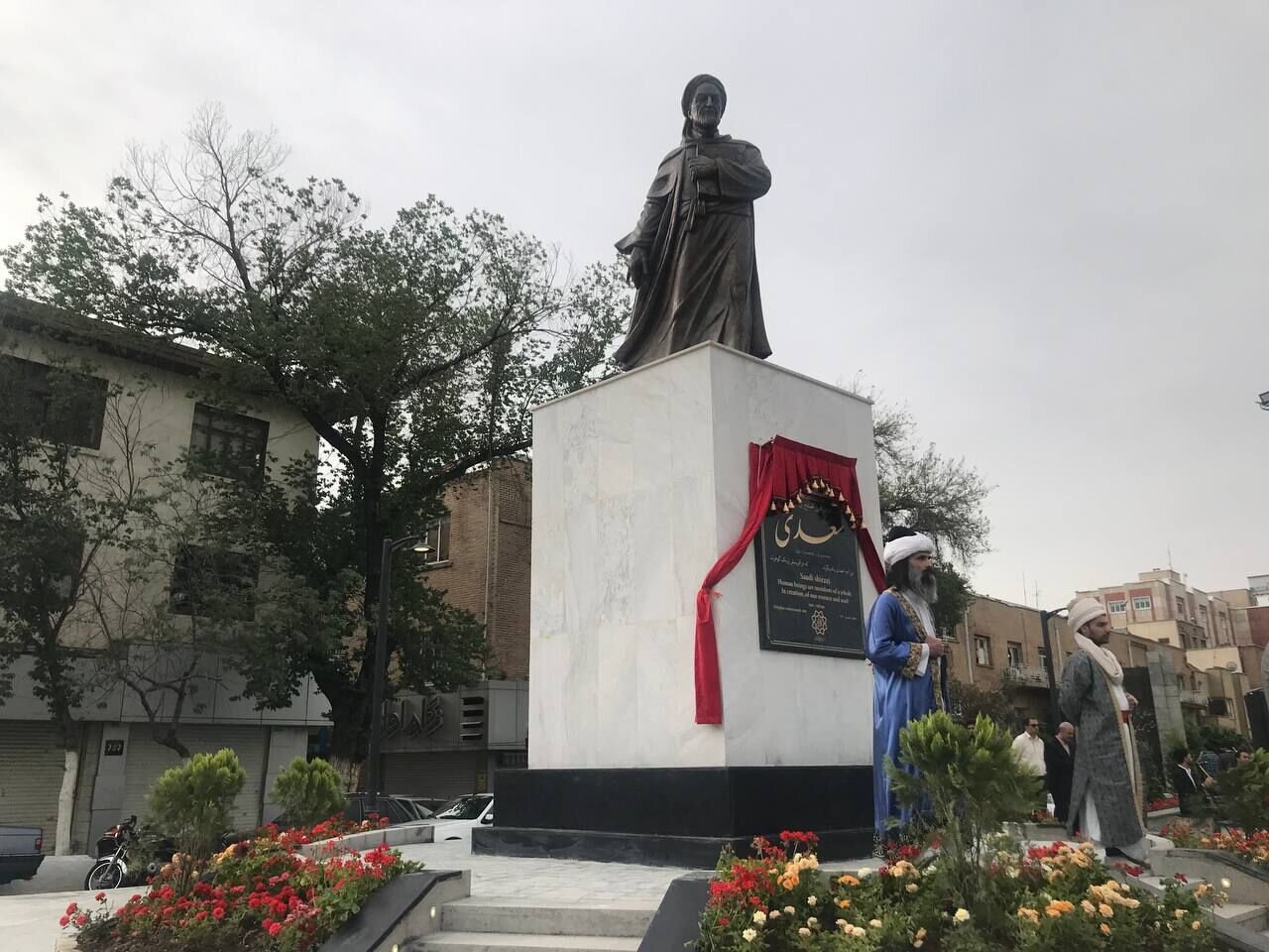 Photo | Ugly act by Urmia Municipality; putting scaffolding on Saadi’s statue as a support for city banners!